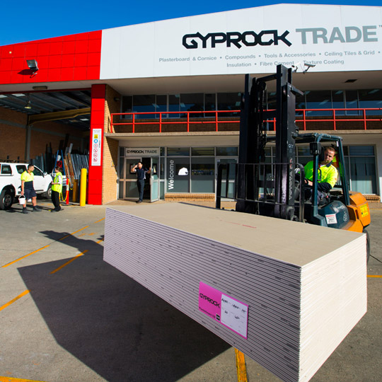 Gyprock plasterboard products on a forklift being transported.